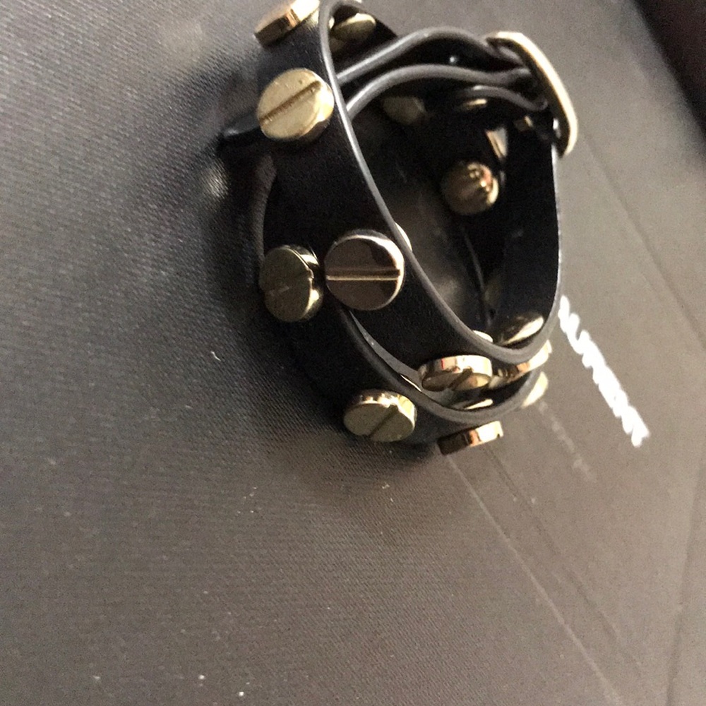 Black & gold detailed wrap around bracelet.